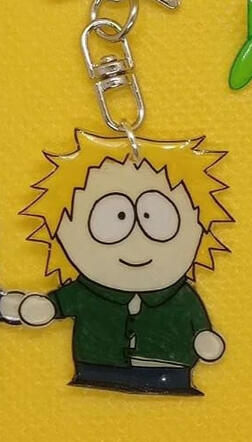 Tweek con imán en la mano